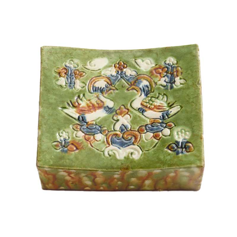 Pillow depicting mandarin ducks in sancai tri-color glaze